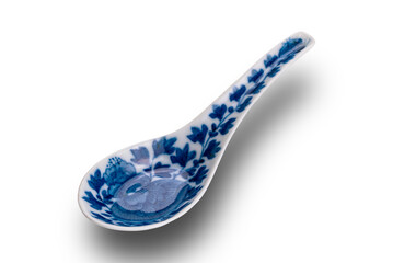High angle view of old blue pattern chinese ceramic soup spoon isolated on white background with clipping path.