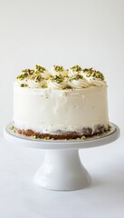 Stunning pistachio layer cake with buttercream frosting in a minimalist bright setting