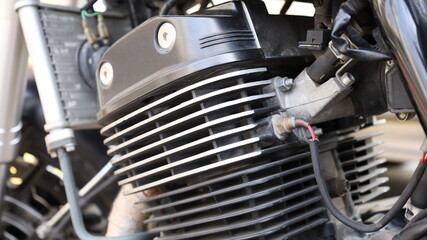 Motorcycle temperature sensor. Close-up dirty temperature sensor on old motorcycle crankcase with selective focus
