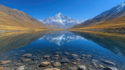 Panoramic view of a serene alpine landscape featuring a majestic mountain with a snow-capped peak,