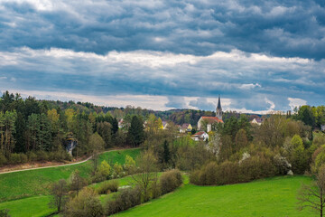 Fototapeta premium View of Thuisbrunn in Franconian Switzerland on a cloudy spring day