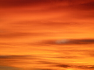Dusk, Sunset Sky Clouds in the Evening with colorful Orange, Yellow, Pink and red sunlight and Dramatic storm clouds on Twilight sky, Landscape horizon