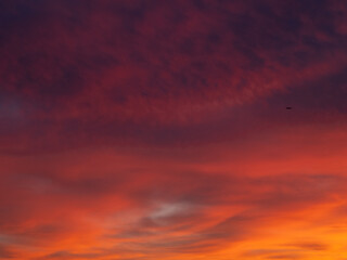 Dusk, Sunset Sky Clouds in the Evening with colorful Orange, Yellow, Pink and red sunlight and Dramatic storm clouds on Twilight sky, Landscape horizon