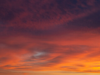 Dusk, Sunset Sky Clouds in the Evening with colorful Orange, Yellow, Pink and red sunlight and Dramatic storm clouds on Twilight sky, Landscape horizon
