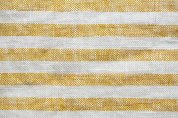 Yellow and white striped fabric with a rustic, woven texture. A seamless, natural pattern ideal for backgrounds, textiles, or decorative designs