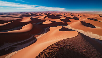 Majestic Sand Dunes Under Vibrant Blue Skies in Serene Desert Landscape