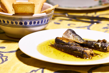 Sardines. Snack, plate of tinned sardines and some toasts