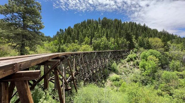 Historic wooden trestle bridge in Cloudcroft, New Mexico, historic mountain railway of the american wild west, rail tracks