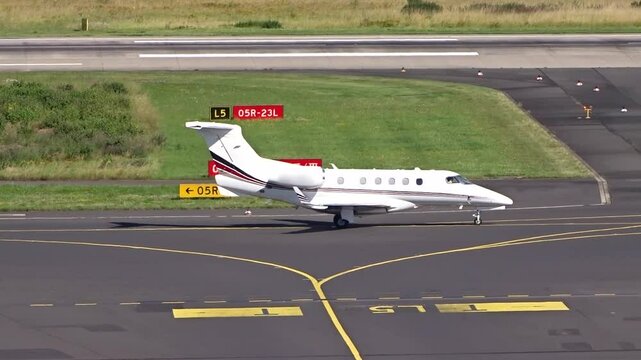 private jet seen taxiing sunshine taxiway international airport luxury exclusivity aviation clip elegance aircraft generic travel experience comfort safety technology airspace control 