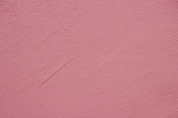 Pink colored abstract wall background texture with different shades of pink