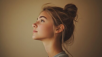 Young Woman Profile View Hair Bun Updo