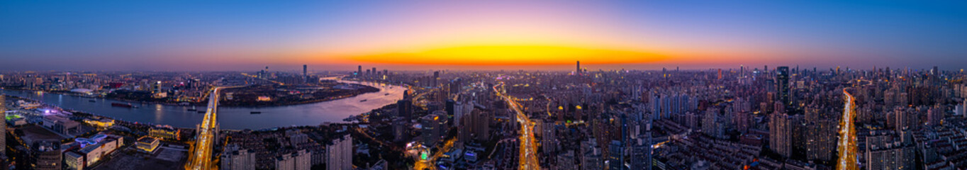 Aerial View of Shanghai skyline with Winding River at sunset