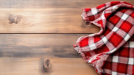 Obraz premium Red and white checkered cloth on wooden surface