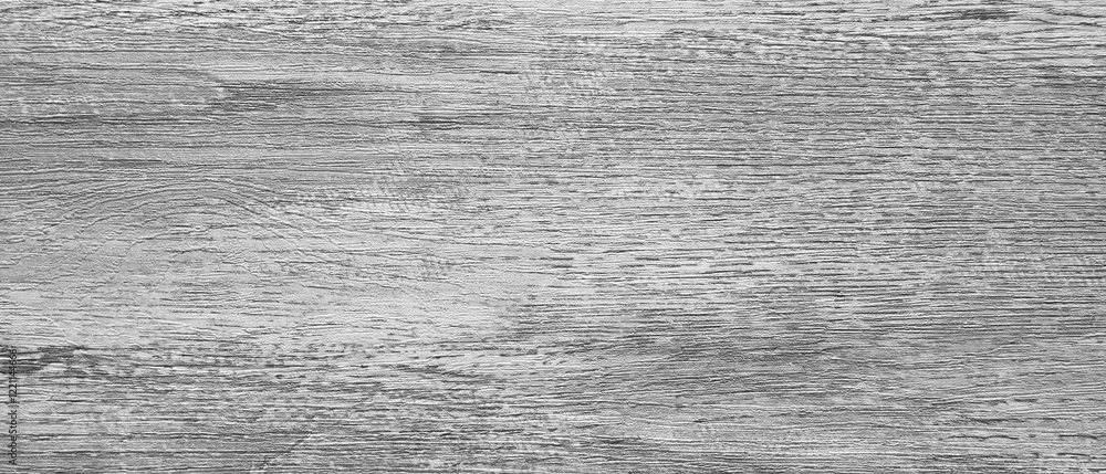 Poster A wooden surface with a grainy texture. The wood is grey and has a rough appearance. The surface is not smooth and has a lot of texture