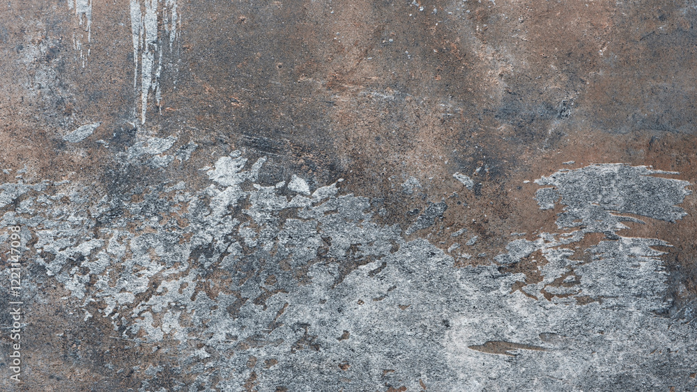 Poster a wall with a lot of paint splatters and a few cracks. the wall is made of concrete and has a rough 