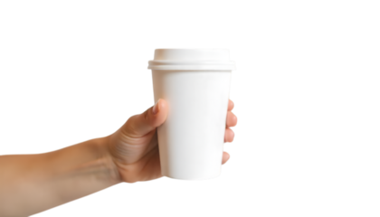 A person holding a white disposable cup against a solid black backdrop in a studio setting