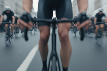A blurry image of a man on a bicycle with a group of other cyclists