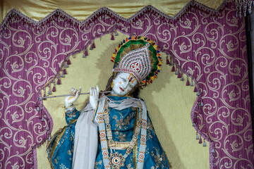India. Rajasthan. Chittorgarh. Chittor Fort. Statue of Krishna playing the flute