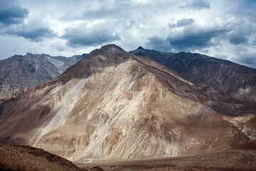 Fototapeta premium The mountains are covered in snow and the sky is cloudy