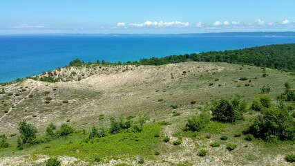 Bubbles floating in front of scenic water view