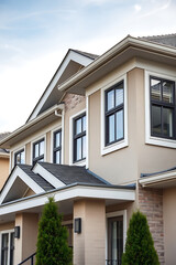 Obraz premium Modern House Exterior: Contemporary Home Design and Architecture. Luxury Real Estate Property with Brick Facade and Stylish Windows