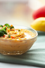 Delicious creamy hummus topped with fresh vegetables. A healthy and flavorful snack or appetizer.