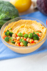 Healthy chickpea dip with broccoli and peppers. A delicious and nutritious vegetarian snack or meal.