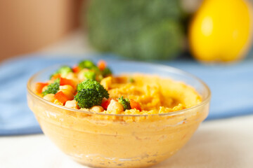Creamy chickpea dip with roasted vegetables. Healthy and delicious vegan snack or appetizer.