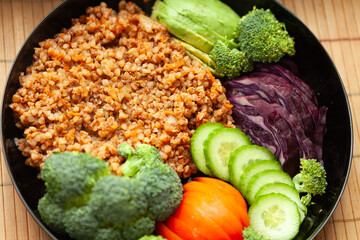 Healthy and colorful buckwheat bowl with assorted vegetables. A nutritious and delicious meal.