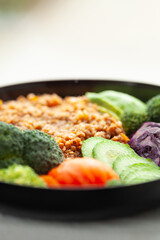 Healthy buckwheat bowl with assorted vegetables.  A nutritious and delicious meal.