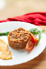 Hearty buckwheat dish with tomato and creamy sauce. A simple yet delicious meal, perfect for a healthy and satisfying lunch or dinner.