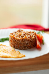 Hearty Buckwheat Porridge with Creamy Sauce and Tomatoes
