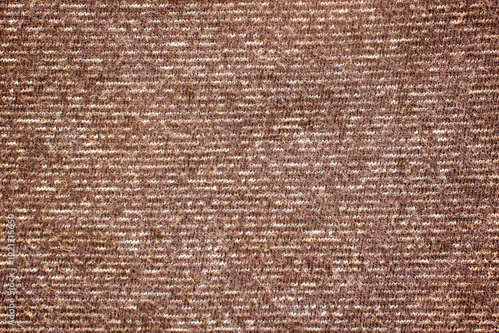 Poster close-up of textured brown fabric showing intricate patterns, perfect for backgrounds in design proj