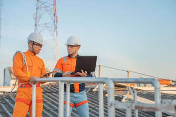 Telecommunication Engineers Working on 5G Tower,Technicians Climbing High Telecom Poles,Ensuring Network Maintenance with Safety Equipment