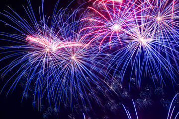 Colorful fireworks lights on the night sky background