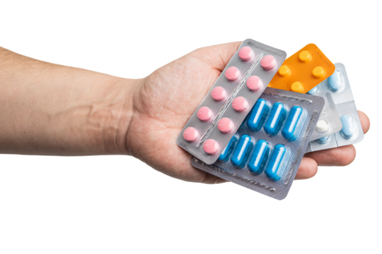 Male hand holding various blister packs with medicine capsules, antibiotic pills, or painkillers, isolated on transparent background. healthcare and treatment concept