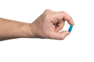 Male hand holding blue medicine capsule, antibiotic pill, or painkiller, isolated on transparent background. healthcare and treatment concept