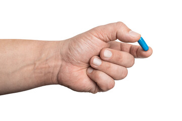 Male hand holding blue medicine capsule, antibiotic pill, or painkiller, isolated on transparent...