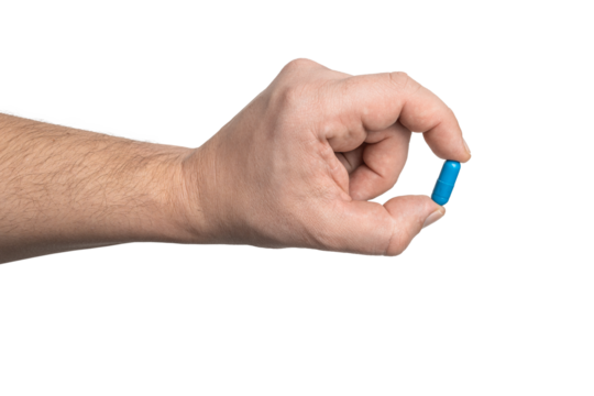 Male hand holding blue medicine capsule, antibiotic pill, or painkiller, isolated on transparent background. healthcare and treatment concept