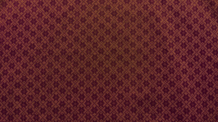 A close up of a red and brown fabric with a pattern