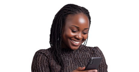 Joyful Texting: A young Black woman with locs smiles radiantly while looking at her smartphone, showcasing a moment of pure digital connection and happiness.