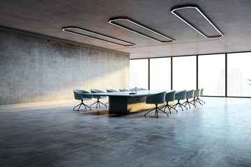 Modern conference room with a long table, chairs, concrete walls, and large windows showcasing a...