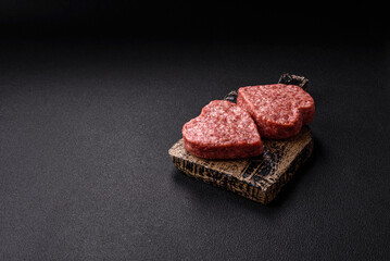 Raw beef or pork burger patty in the shape of a heart