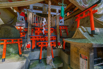 Kyoto, Japan - Sep 23 2024, panoramic view of the stone gate of the torii, behind which there is an...