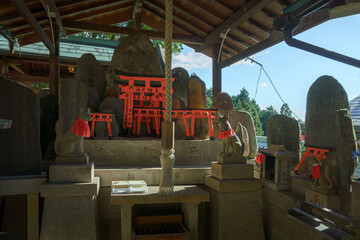 Kyoto, Japan - Sep 23 2024, panoramic view of the stone gate of the torii, behind which there is an...