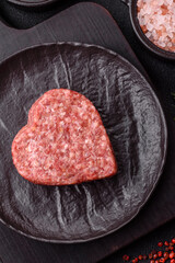 Raw beef or pork burger patty in the shape of a heart