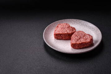 Raw beef or pork burger patty in the shape of a heart