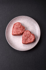Raw beef or pork burger patty in the shape of a heart