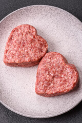 Raw beef or pork burger patty in the shape of a heart