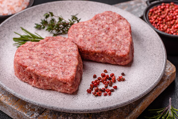 Raw beef or pork burger patty in the shape of a heart